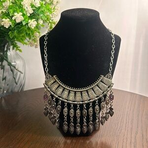 Intricate silver tone statement necklace with lobster closure